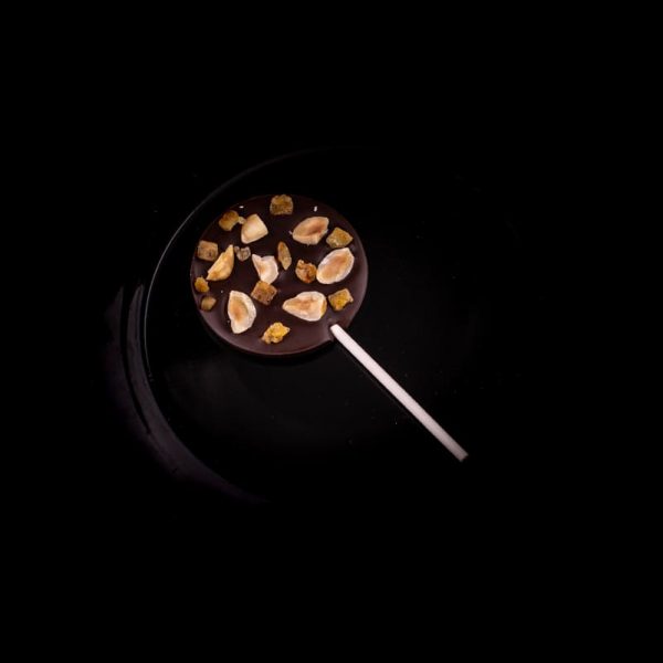 MH Chocolate - Piruleta de chocolate negro, naranja y avellanas