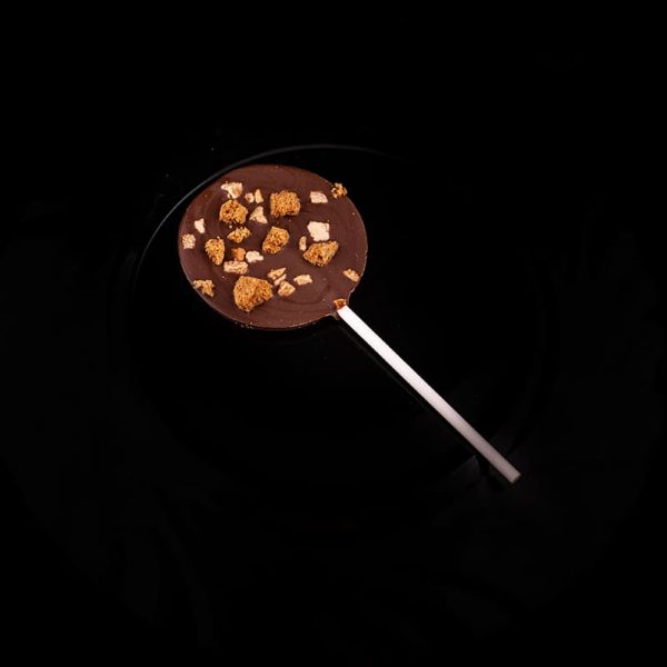 MH Chocolate - Piruleta chocolate con leche, galleta lotus y granillo de almendra